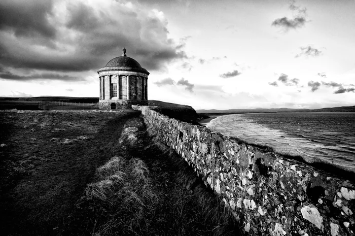 black and white landscape photogaphy coastal tower