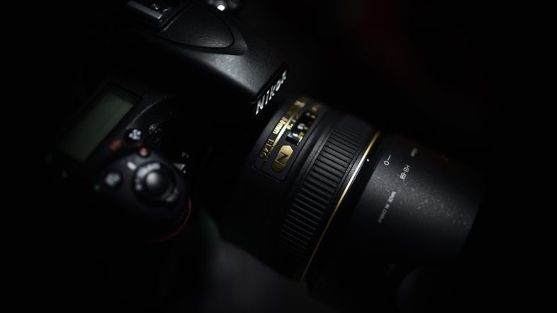 Nikon camera lens black background 5120x2880
