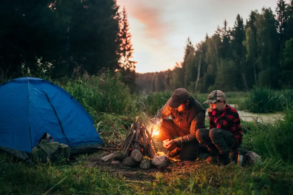 father and son camping together picture id833226490