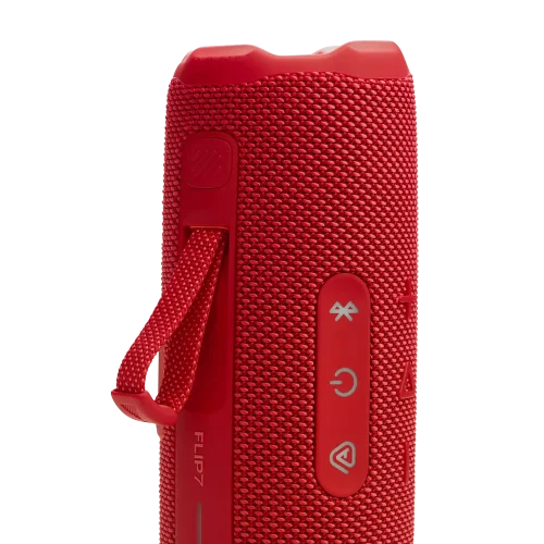 اسپیکر JBL Flip 7 قرمز با بند و دکمه‌ها در حالت ایستاده