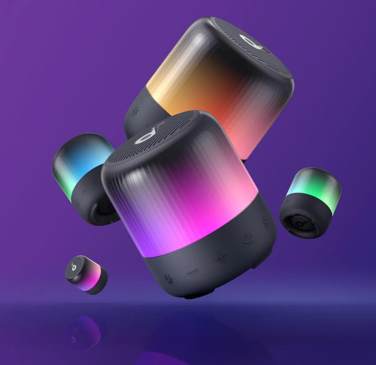 اسپیکرهای Soundcore Glow Mini در رنگهای متنوع با نورپردازی هماهنگ در پسزمینه بنفش