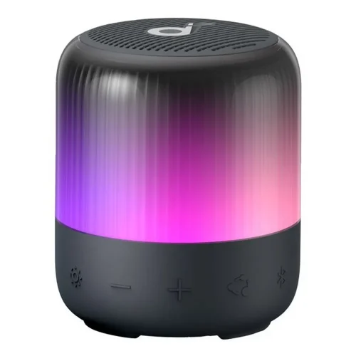 اسپیکر Soundcore Glow Mini با نور بنفش و صورتی روی سطح سفید